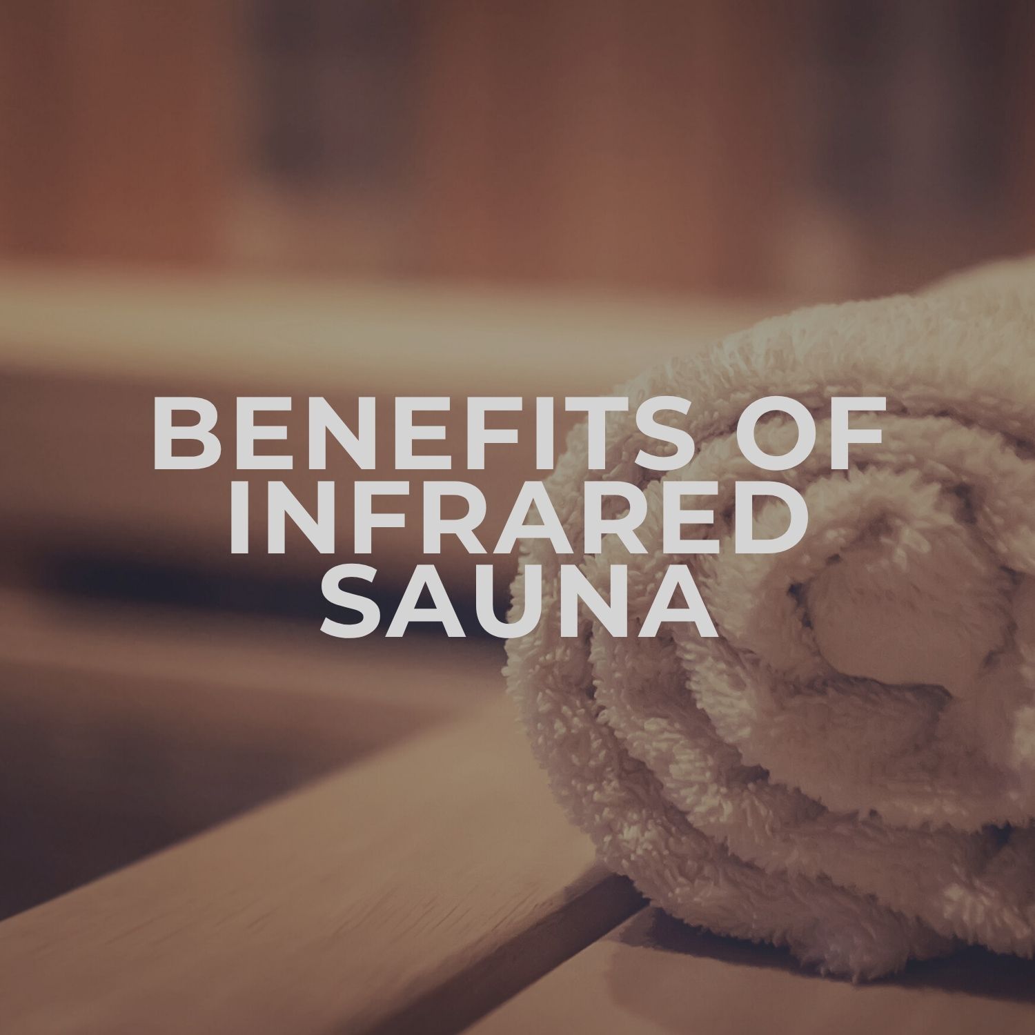 Infrared sauna benefits with towel backdrop.